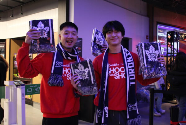 GoodLife Fitness brand ambassadors holding Toronto Maple Leafs merchandise.